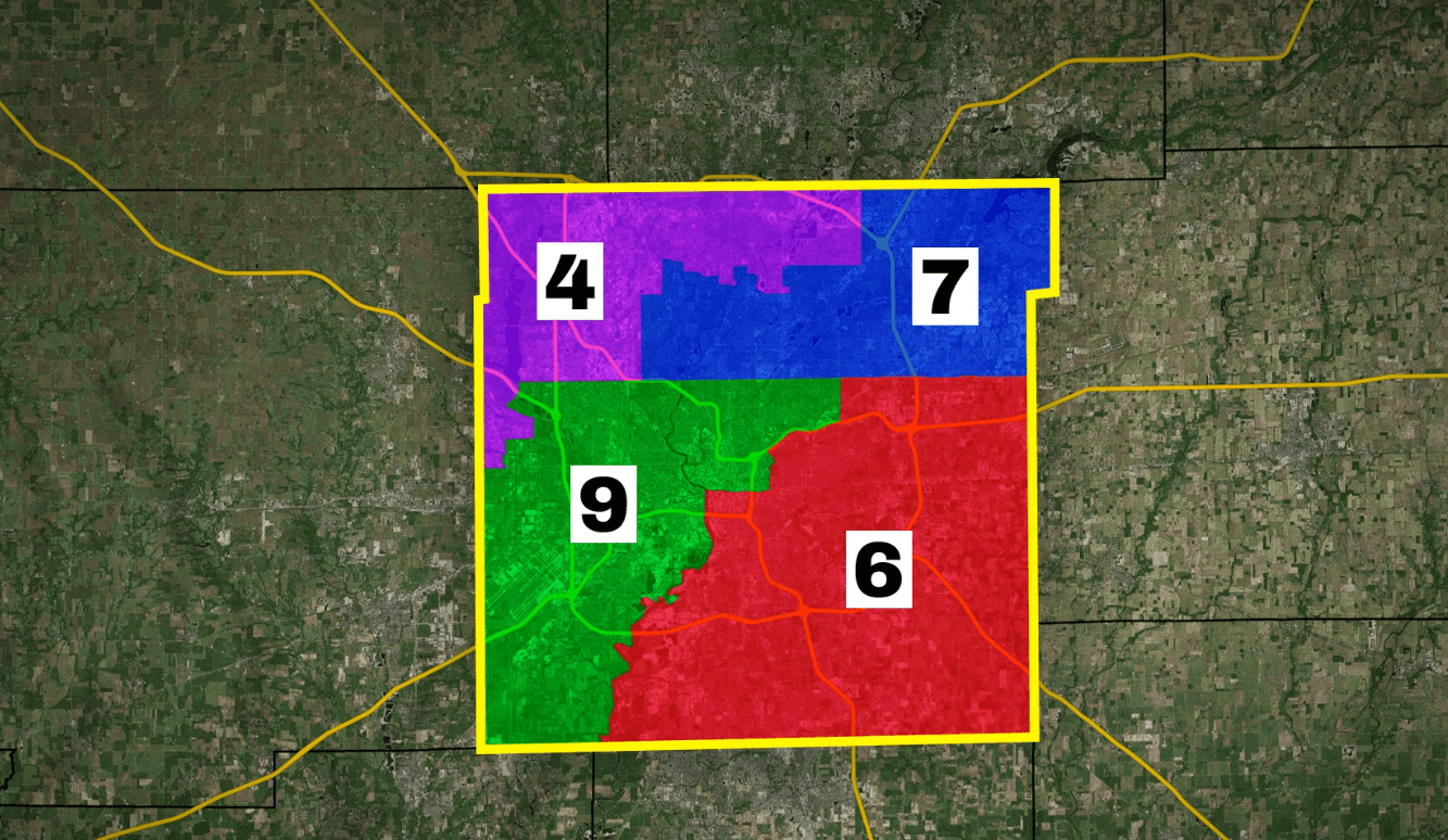 Close-up of Marion County showing how the proposed map would split Indianapolis into four congressional districts: District 4 (northwest, purple), District 7 (northeast, blue), District 9 (southwest and downtown, green), and District 6 (southeast, red).